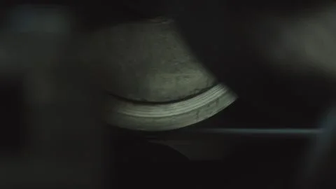 Close up of a spinning machine roller producing product Stock Photos