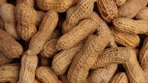 Close up of spinning pile of peanuts Stock Footage 275248165