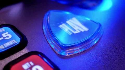 Close up spinning play button on slot machine inside Hard Rock Casino Video stock 75331815