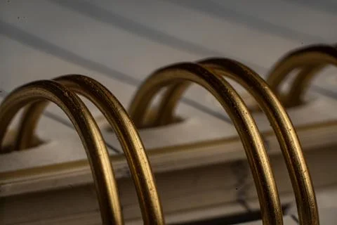 Close-up of spiral binding showcasing intricate details in an office notebook Stock Photos