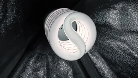 Close-up of spiral CFL bulb glowing inside a softbox, showing diffused studio Stock Footage 332456456