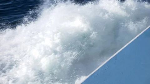 Close up splashes boat against ocean waves. Super slow motion 4K Video stock 284240295