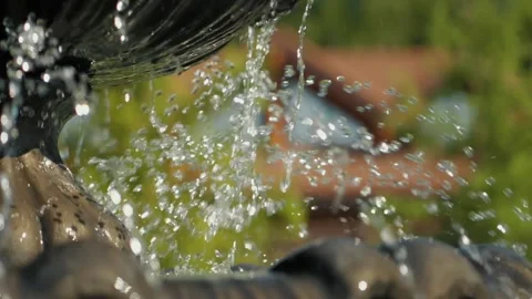 Close up on the splashing water falling from the working fountain Stock Footage 148731892