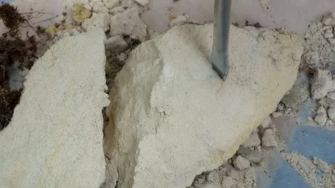 Close-up of Splitting a marlstone rock into pieces Stock Footage 276423783