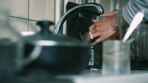 Close-up of sponge with dishwashing liquid starting to clean dirty plate Stock Footage 310242559
