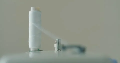 Close-up of a Spool with Thin Thread on Working a Vintage Sewing Machine. Spool 스톡 동영상 130782111