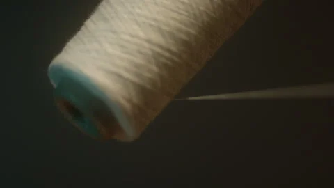 Close up of spool of white thread Stock Footage 311112515