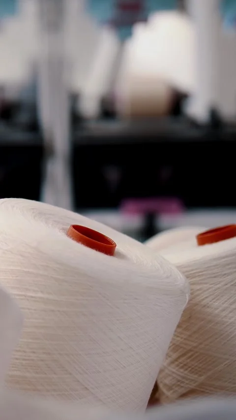 Close-up spools of yarn thread. Spinning production. Textile factory. Yarn Stock Footage 318726497