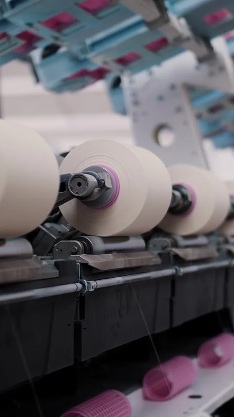 Close-up spools of yarn thread. Textile factory equipment. Textile factory. Stock Footage 315365308