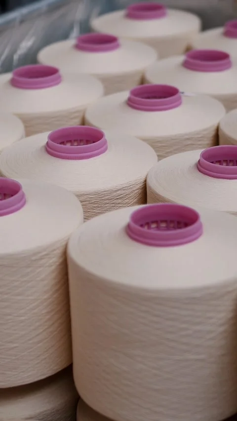 Close-up spools of yarn thread. Textile factory. Yarn making processes. Threads Stock Footage 317439916