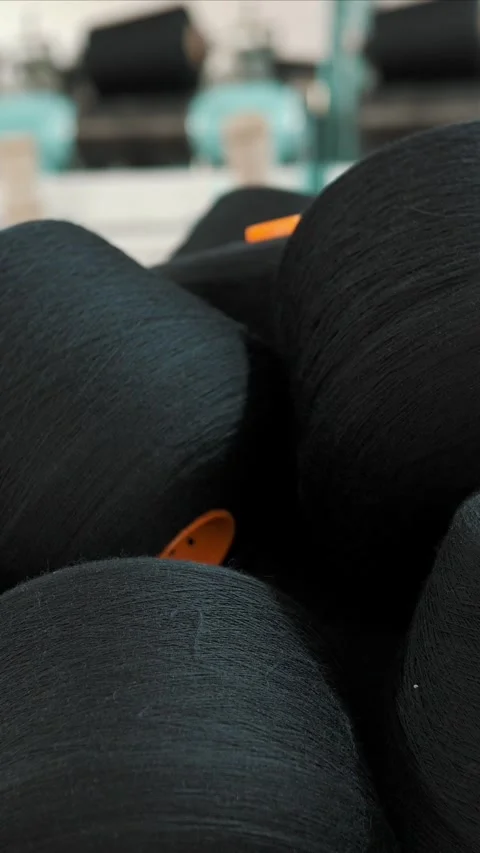 Close-up spools of yarn thread. Textile factory. Yarn making processes. Threads Stock Footage 318077691