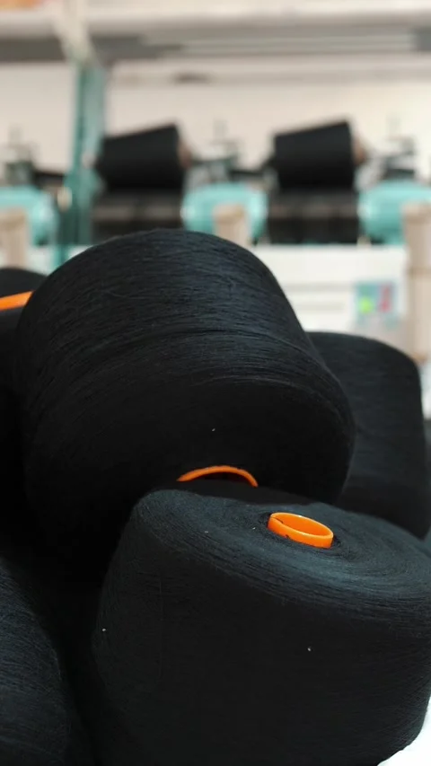 Close-up spools of yarn thread. Yarn making processes. Textile factory equipment Stock Footage 321461353