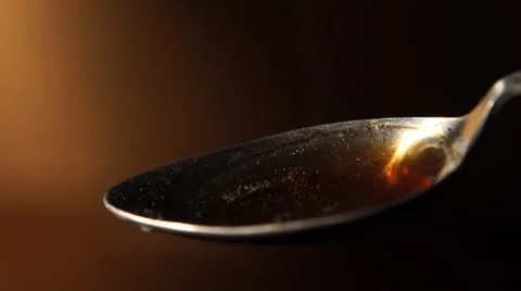 Close-up of a spoon with drug, light and syringe Stock Footage 46344136