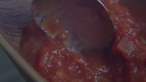 Close up of spoon mixing salsa sauce in bowl Stock Footage 318724429