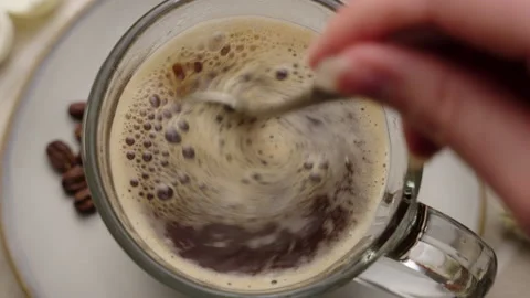Close-up of a spoon stirring a cup of coffee Stock-Footage 237546824