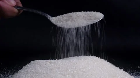 Close up spooning sugar isolated on black background 库存影片 281636287