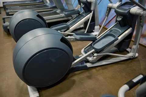Close-up of sport equipment in fitness centre. Cardio workout concept Stock Photos