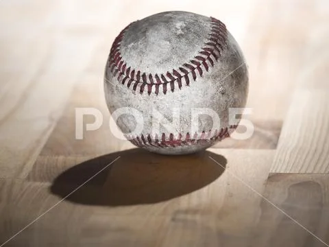Close up sports background image of an old used weathered leather baseball sh Stock Photos
