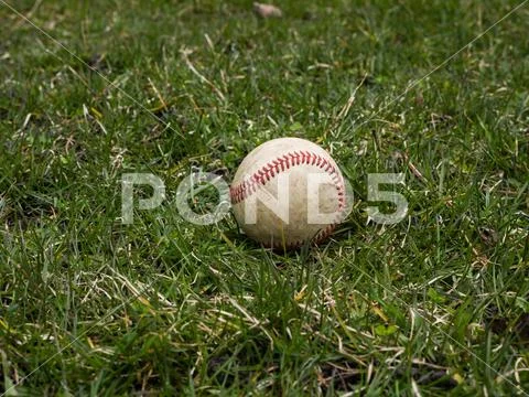 Close up sports background image of an old used weathered leather baseball ba Stock Photos