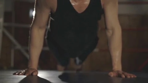 A close-up of sportsman doing push ups in the gym. Slowly Video stock 75251432