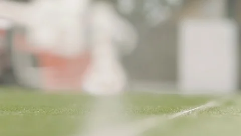 Close up of spray paint machine spraying paint on football field Stock Footage 104768859