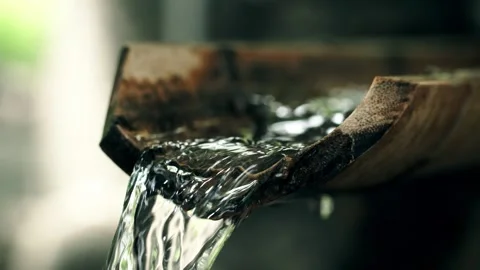 Close-up of the spring flowing Zen water surface Video stock 257986019