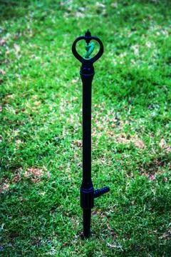 Close up sprinkle water on the feild Stock Photos