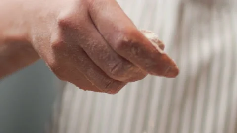 Close-up sprinkling in slow-motion with flour in 4K. Stock Footage 137427906