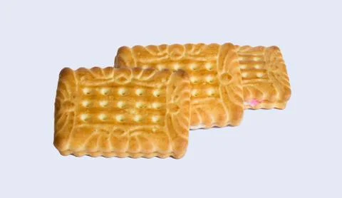 Close up of square shape cream biscuits filled with white and pink cream  iso Stock Photos