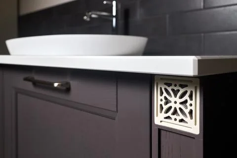 Close up square shape lattice element of brightly lit wooden painted cabinet Foto stock