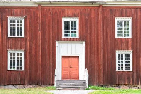 Close up of square white windows in old red wooden barn wall, Sweden Stock Photos