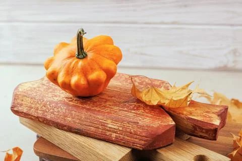 Close-up of squash on distressed red cutting board Stock Photos