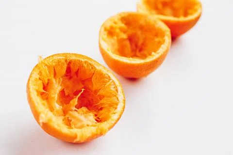 Close up of squashed oranges on white background Stock Photos