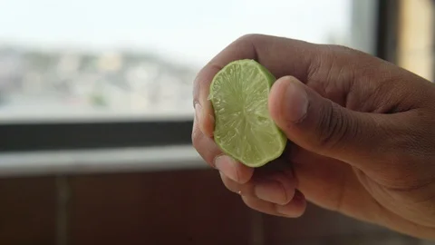 CLOSE UP OF SQUEEZE LEMON Stock Footage 107287488