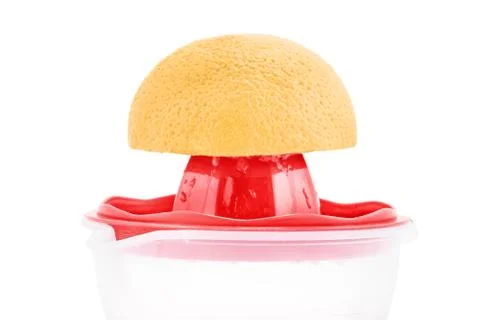 Close-up of a squeezer and an orange Stock Photos
