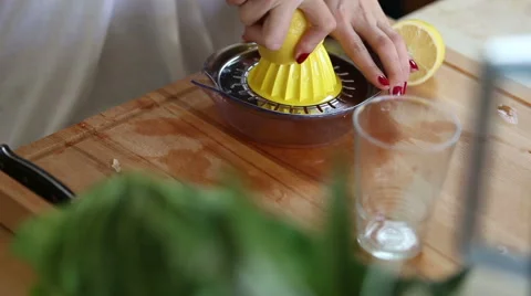 Close-up of squeezing lemon on squeezer Stock Footage 59541527