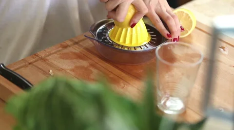Close-up of squeezing lemon on squeezer Stock Footage 59541531