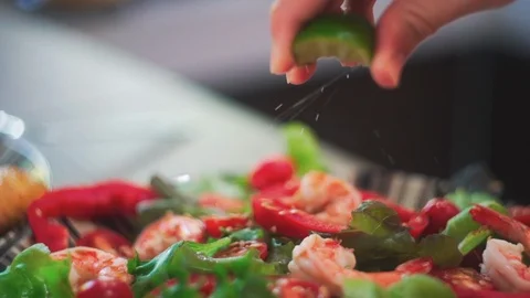 Close up of Squeezing Lime into Salad Slow Motion. Stock Footage 114667414