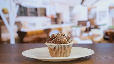 Close-up, squeezing white cream on muffin Stock Footage 74135769