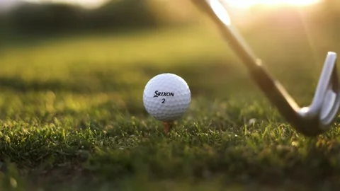 Close-up of Srixon Golf Ball Being Hit by Swinging Golf Pitching Wedge Club Stock Footage 200516200
