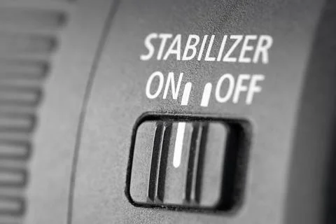 Close-up of the stabilization of the switch button in a modern lens, macro .. Stock Photos