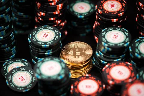 Close-up of a stack of bitcoin coins on a stack of casino chips Stock Photos
