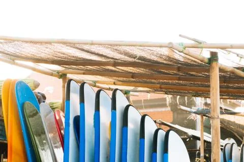 Close up stack of blue color soft surfboards in a stack by ocean.Bali.Indonesia Stock Photos