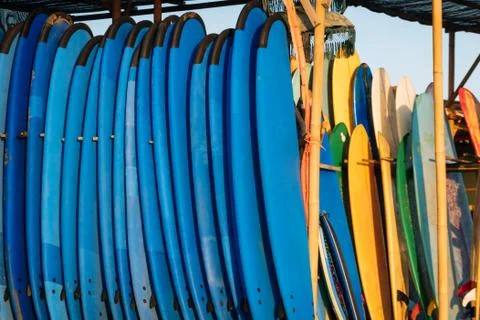 Close up stack of blue color soft surfboards in a stack by ocean.Bali.Indones Stock Photos