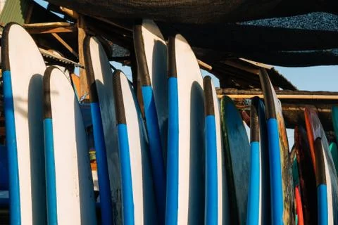Close up stack of blue color soft surfboards in a stack by ocean.Bali.Indones Stock-Fotos