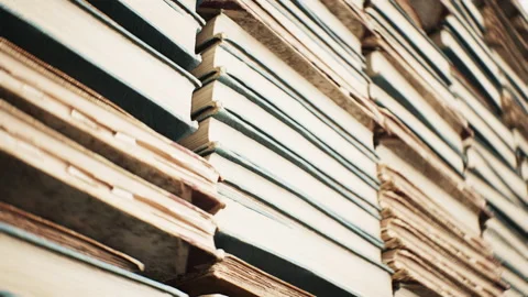 Close up of a stack of books in library room interior. 3D animation. 4K.	 Stock Footage 336718310