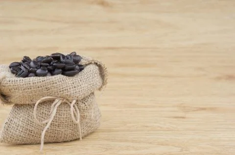 Close up stack of coffee bean in brown sack Stock Photos