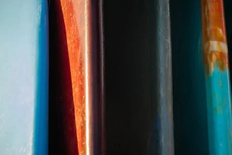 Close up Stack of colorful surfboards on beach background for rent. Travel ad Фото