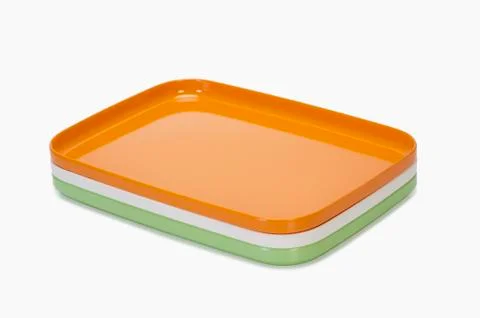 Close-up of a stack of colorful trays representing Indian flag colors 스톡 사진