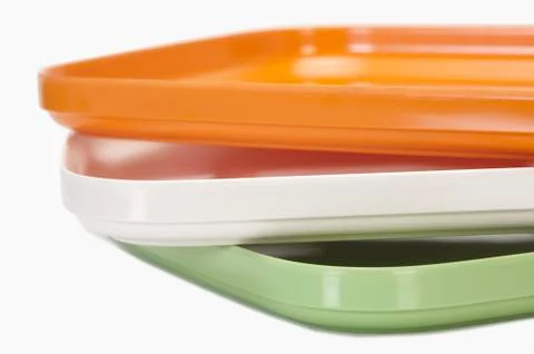 Close-up of a stack of colorful trays representing Indian flag colors Stock Photos